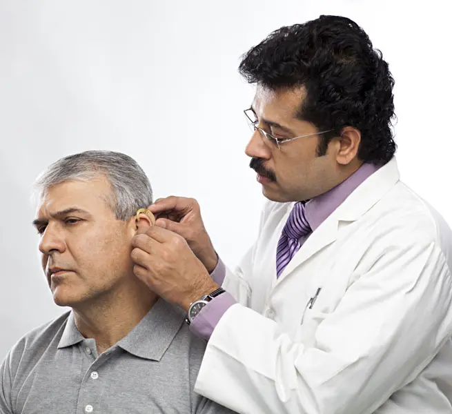 Medical students observing a procedure