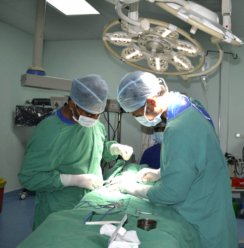 Medical students observing a procedure